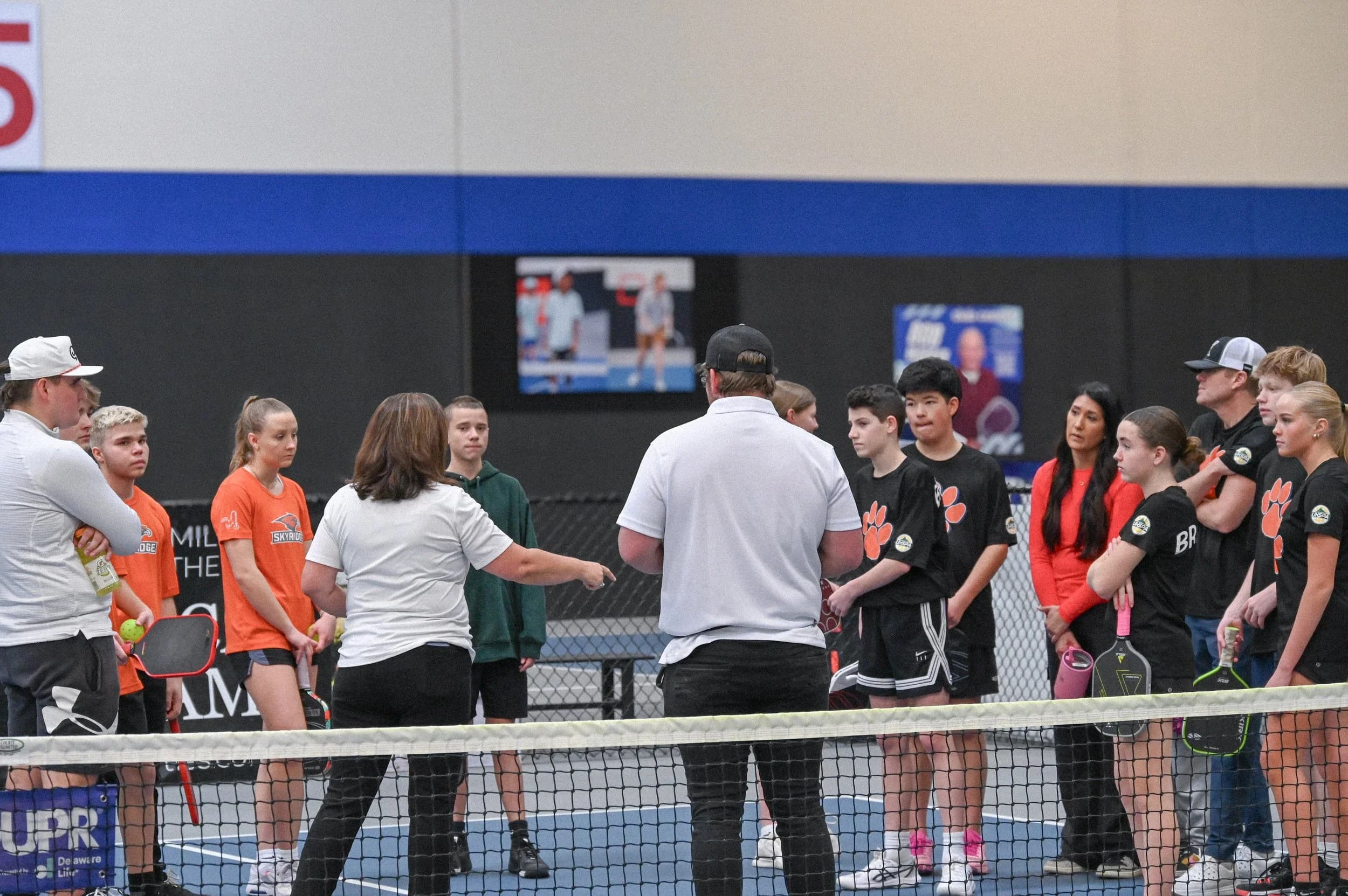 UHSPA players and coaches gathered for pre-match instructions on court